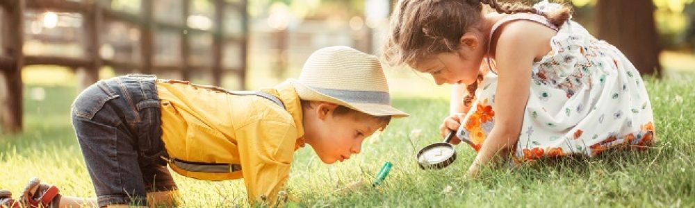 Cute,Adorable,Caucasian,Girl,And,Boy,Looking,At,Plants,Grass
